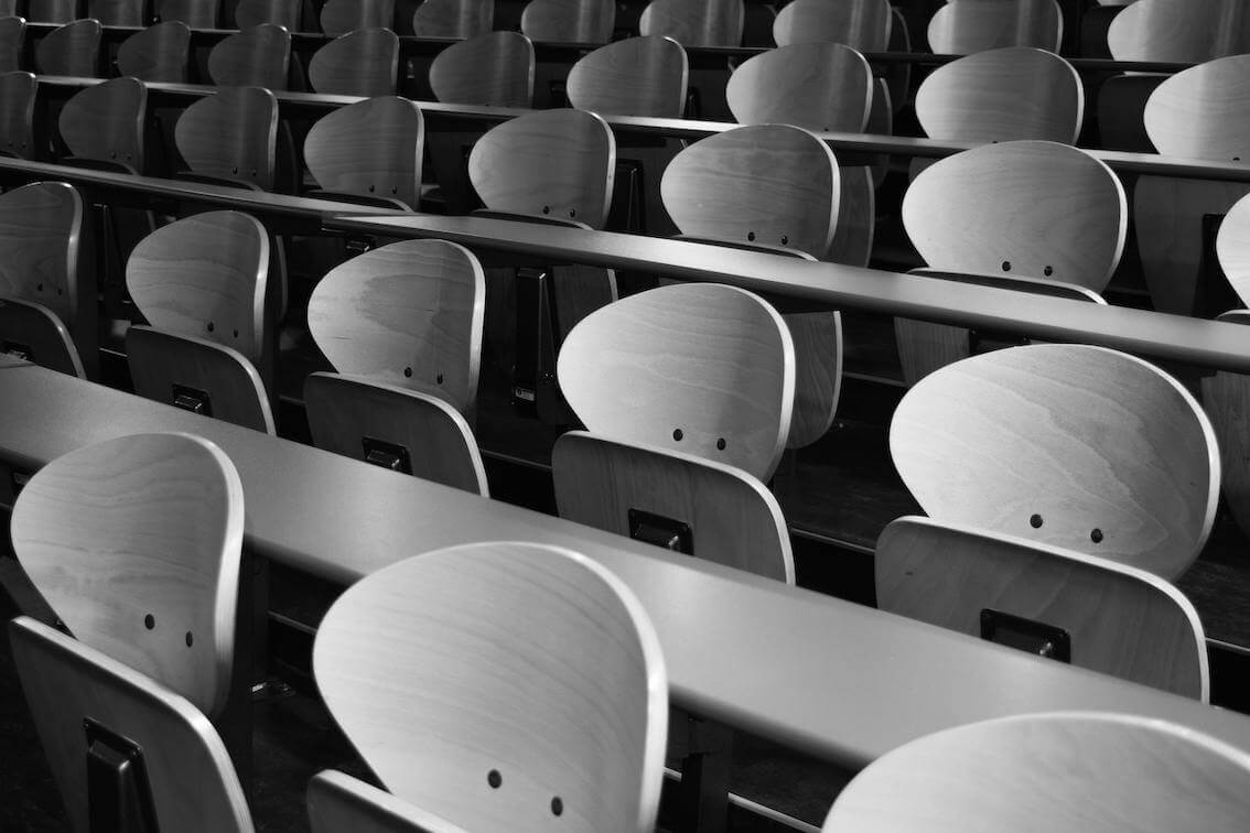 wooden table and chairs in classroom